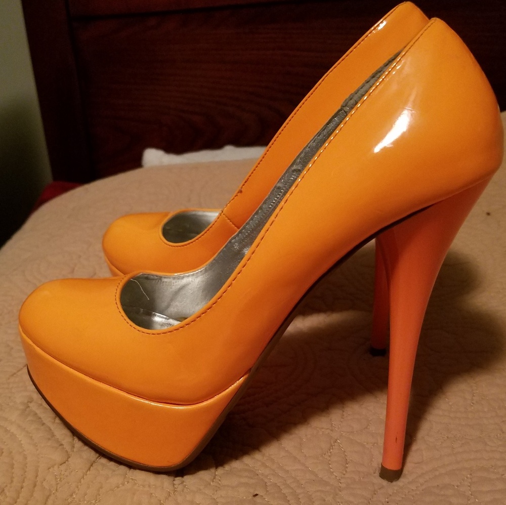 Bright orange pumps